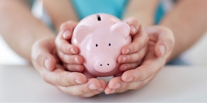 Person holding piggy bank