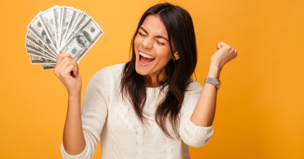 Excited Person Holding Money