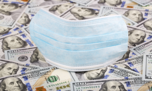 American currency and medical face mask