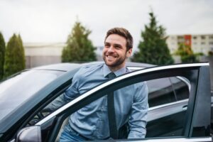 Man Getting Out Of Car Happy