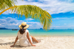 Woman Under Palm Leaf